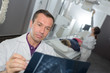 © auremar - doctor looking at an x-ray