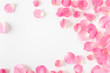 © praewpailyn - Top view of pink rose petals on white background.Valentine's day concept.
