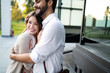 © NDABCREATIVITY - Young couple in love hug each other outside