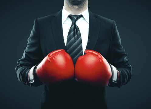 businessman in red boxing gloves