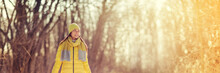 Winter Forest Walk Asian Woman Wearing Cold Weather Clothes Walking In Outdoor Nature Park Relaxing Banner Panoramic Header.