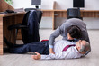 © Elnur - Male employee suffering from heart attack in the office