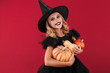 © Drobot Dean - Little girl witch in carnival halloween costume