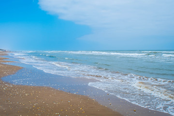 A beautiful soft and fine sandy beach along the gulf coast of South Padre Island, Texas