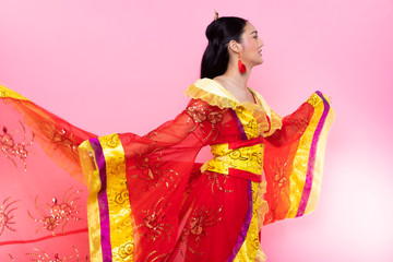 Wall Mural - Red Gold lace of Chinese Traditional Costume Opera or South East Asia Reddish Dress in Asian Woman with decoration portrait in many poses under Studio lighting Pink background, collage group pack