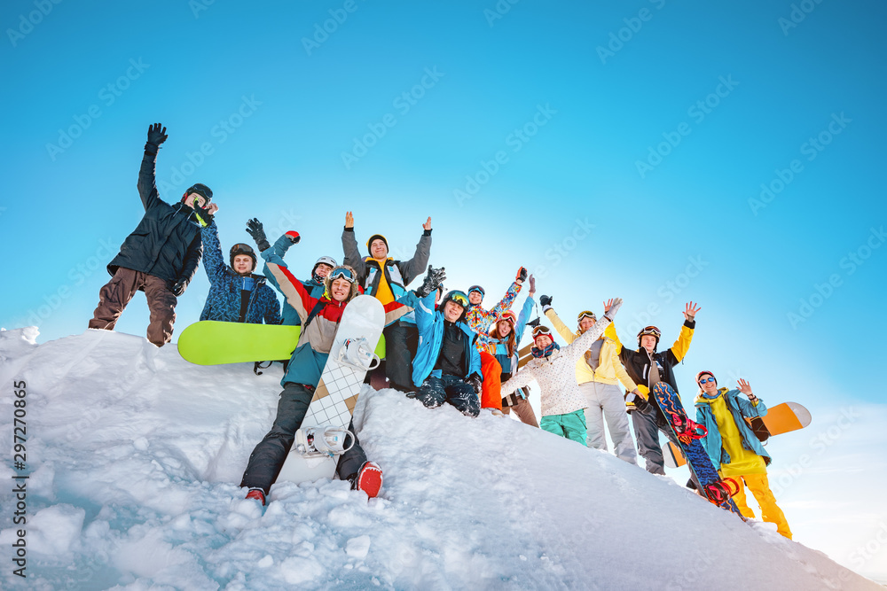 Big group of skiers and snowboarders at ski resort - obrazy, fototapety, plakaty 