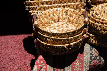 Wall Mural - Empty wicker baskets for sale in a market place