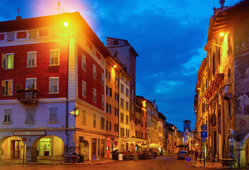 Nettuno Fountain in Duomo square and Civic tower. Trento. Italy