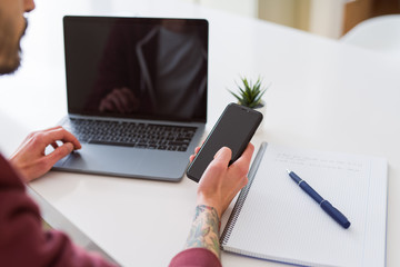 Wall Mural - Business man working using computer laptop and smartphone, showing blank screen