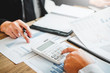 © joyfotoliakid - Business man Accounting Calculating Cost Economic budget investment and saving concept