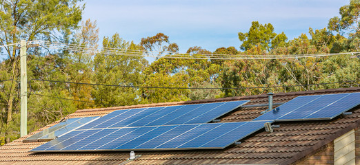 View of rooftop solar power panels for clean, free and renewable energy supply in Australian homes  