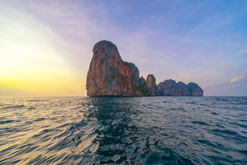 Phi Phi, Maya beach with blue turquoise seawater, Phuket island in summer season during travel holidays vacation trip. Andaman ocean, Thailand. Tourist attraction with blue cloud sky.