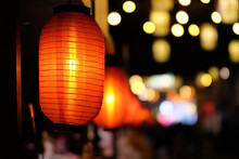Close Up Many Traditional Chinese Red Lantern At Dark Night. Colorful Blur Lights Background.