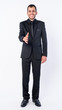 © Ranta Images - Full body shot of happy young bearded Persian businessman in suit giving handshake