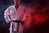 Karate martial arts fighter on dark background
