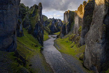 The most picturesque canyon Fjadrargljufur and the shallow creek, which flows along the bottom of the canyon. Fantastic country Iceland. September 2019. aerial drone shot