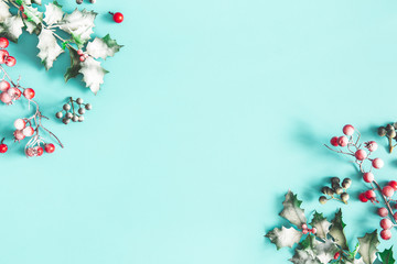 christmas composition. frame made of christmas plants on blue background. flat lay, top view, copy s