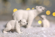 Decorative Figurines Of A Christmas Theme. Statuettes Of A Family Of Polar Bears. Christmas Tree Decoration. Festive Decor, Warm Bokeh Lights.