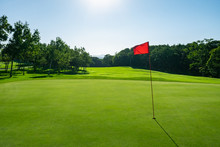 Panorama View Of Golf Course With Beautiful Putting Green. Golf Course With A Rich Green Turf Beautiful Scenery.