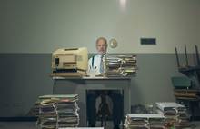 Frustrated Businessman Overloaded With Paperwork