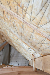 Wall Mural - House under construction with insulation glass wool on an attic floor