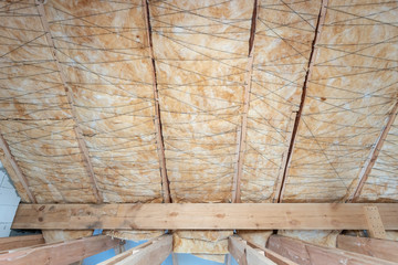 Wall Mural - House under construction with insulation glass wool on an attic floor