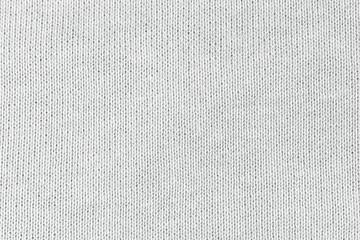 white natural texture of knitted wool textile material background. white cotton fabric woven canvas 