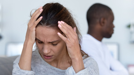 Wall Mural - Stressed young wife depressed after fight with biracial husband