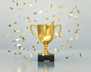 gold winners trophy, champion cup with falling confetti