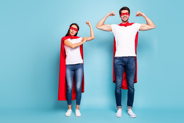 Poster - Full length body size view of nice competitive cheery sporty people in red hero look showing arm muscle weak female gender vs masculine isolated on bright vivid shine vibrant blue turquoise background