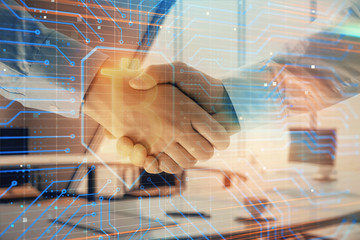 Double exposure of blockchain theme drawing on office background with two businessmen handshake. Concept of crypto economy