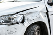 © Milan - Car crash or accident. Front fender and light damage and scratchs on bumper. Broken vehicle detail or close up.