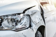 © Milan - Car crash or accident. Front fender and light damage and scratchs on bumper. Broken vehicle detail or close up.