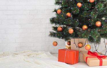 Wall Mural - Christmas tree with gift boxes in home interior