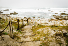 Pathway With Railings Leading To Beach