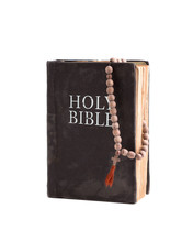 Holy Bible Isolate On White Background. Vintage Old Bible And Church Rosary.