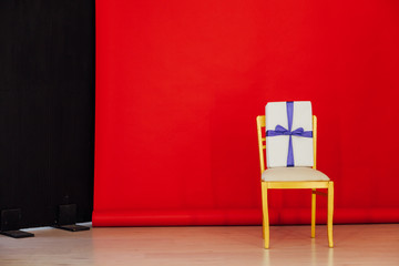 Sticker - chair in the interior of the room with a red background