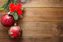 Christmas Background Mock Up Red Baubles Decoration With Fir Branches On Wooden Background, Copy Space.