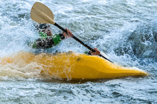 Man In A Yellow Kayak White Water Rafting