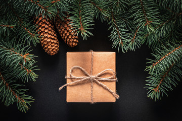 Wall Mural - A frame of fir branches and  gift paper box tied with twine. Christmas card blank.