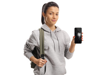 Female student holding a smartphone with a broken screen