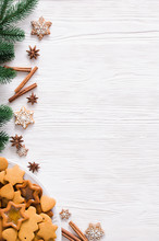 Culinary Background With Freshly Baked Christmas Gingerbread, Spices And Fir Branches. Copy Space