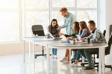 Poster - Group of students preparing for exam in university