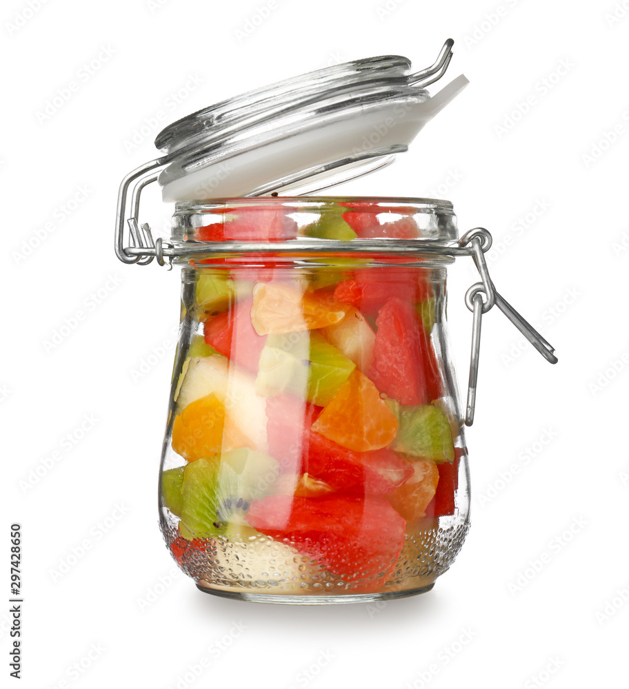 Jar of tasty fruit salad on white background