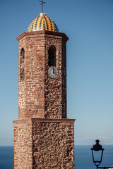 Wall Mural - CASTELSARDO, SARDINIA / OCTOBER 2019:  view of the bell tower of the cathedral