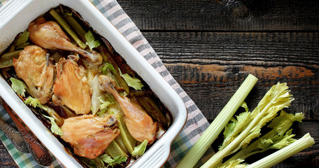 Wall Mural - baked chicken pieces with celery stalk. chicken with celery. top view. copy space. keto recipe, low carb