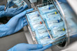 Dentist is loading dental probes into sterilize machine
