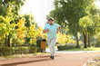 © New Africa - Young overweight man running in park on sunny day