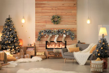 Stylish Room Interior With Beautiful Christmas Tree And Decorative Fireplace