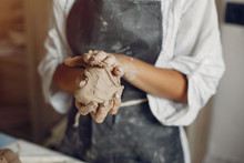 Woman In A Pottery. Master Make A Dishes. Artist Works With A Clay